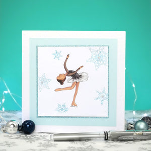 6 x 6 inch greeting card with image of a figure skater in a black dress, surrounded by blue foiled ornate snowflakes