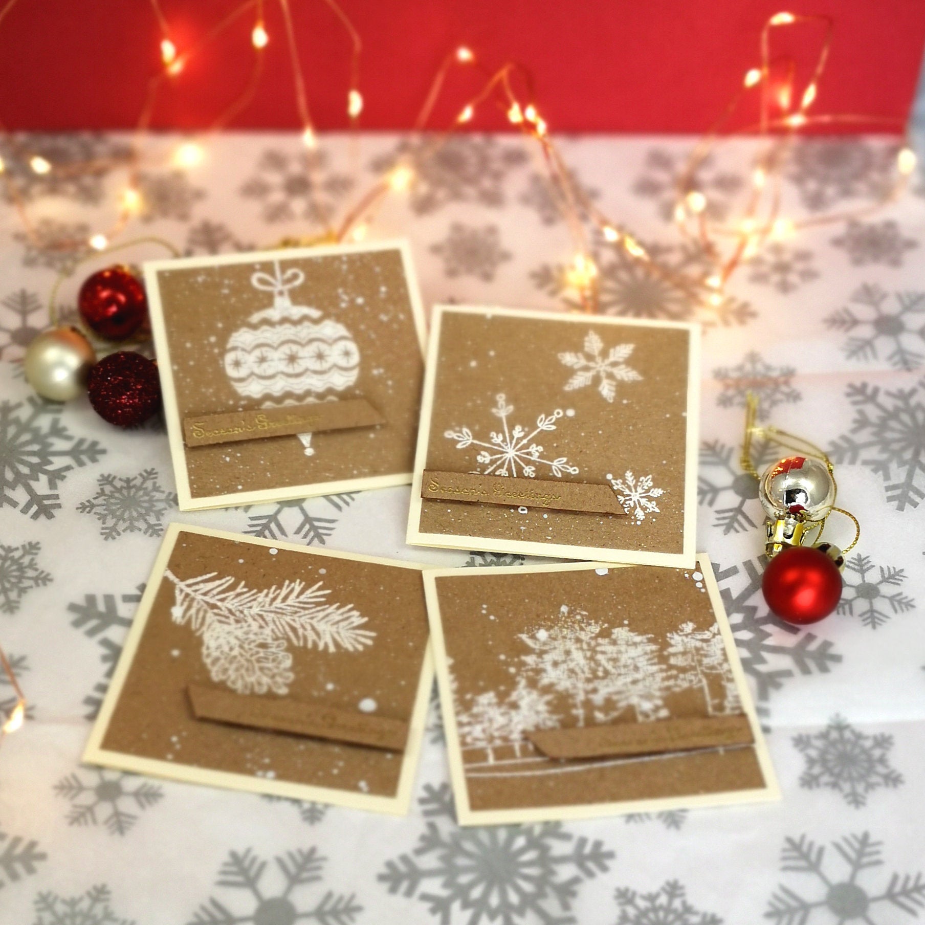 Handmade set of mini christmas cards with white & gold details on kraft cardstock.