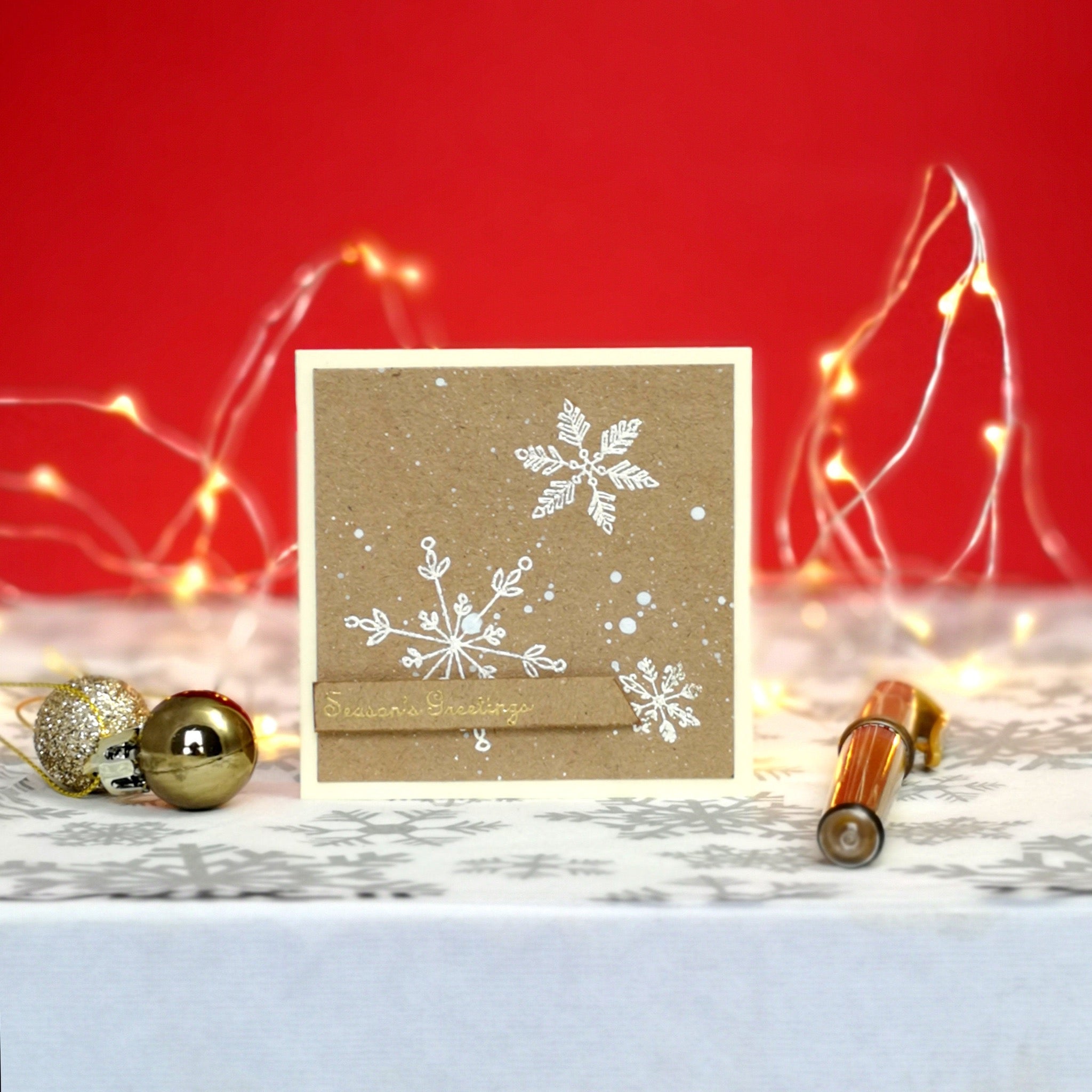 Handmade mini christmas card with white & gold details on kraft cardstock.