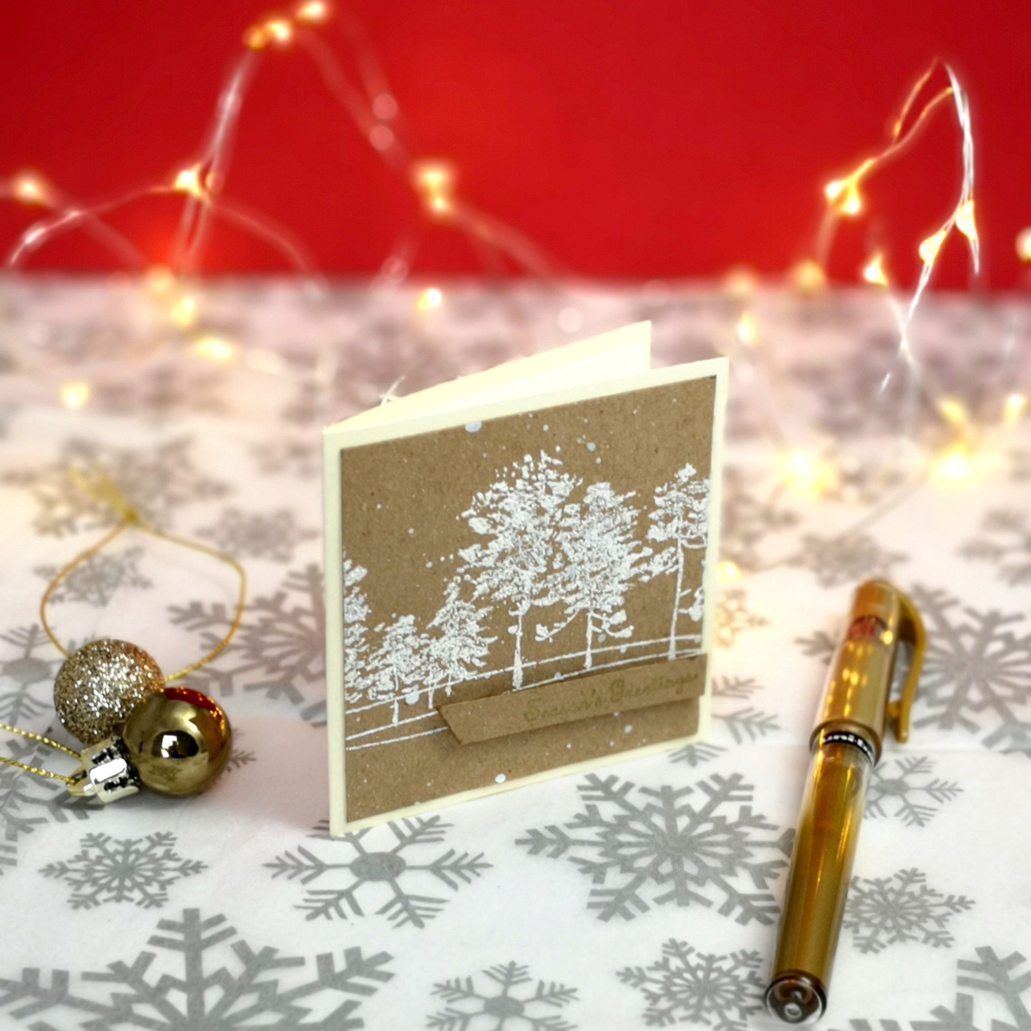 Handmade mini christmas card with white & gold details on kraft cardstock.