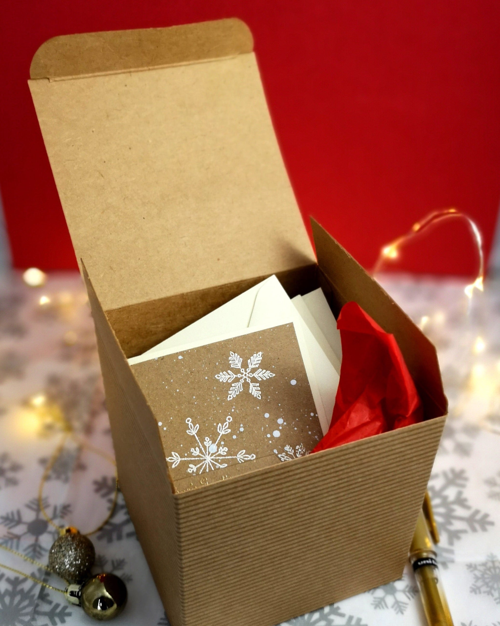 Handmade boxed set of mini christmas cards with white & gold details on kraft cardstock.