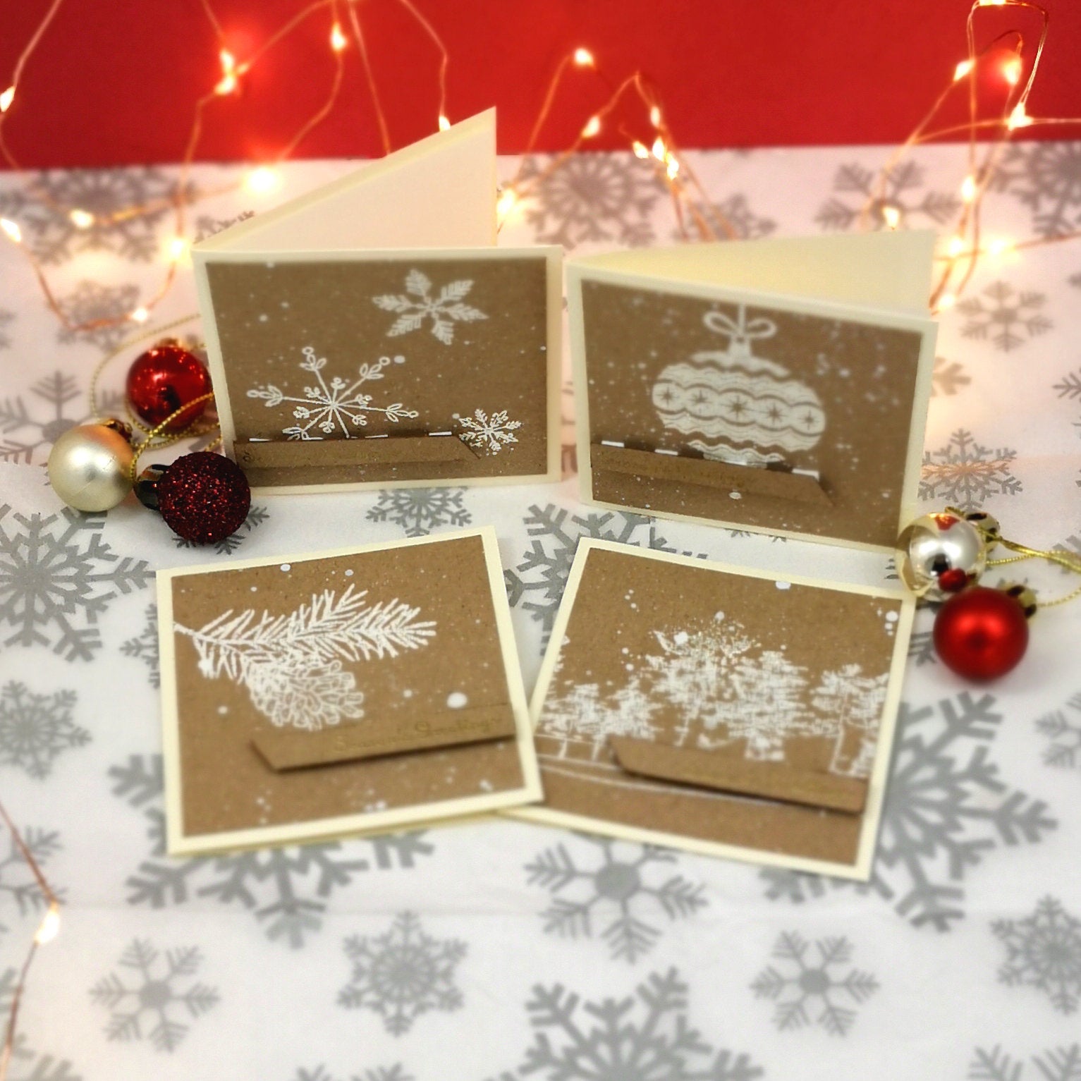 Handmade set of mini christmas cards with white & gold details on kraft cardstock.